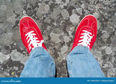 red sneakers with white laces.